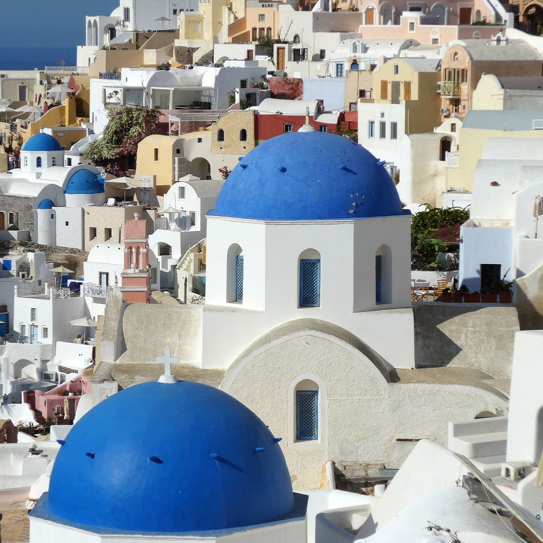 Santorini Aglow: Cliffs, Sunsets & Blue-Domed Villages